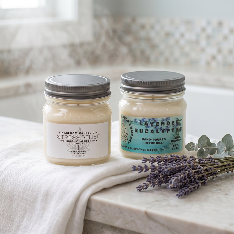 Relaxing candle collection — Stress Relief and Lavender Eucalyptus on a folded white towel on a marble bath edge with dried lavender