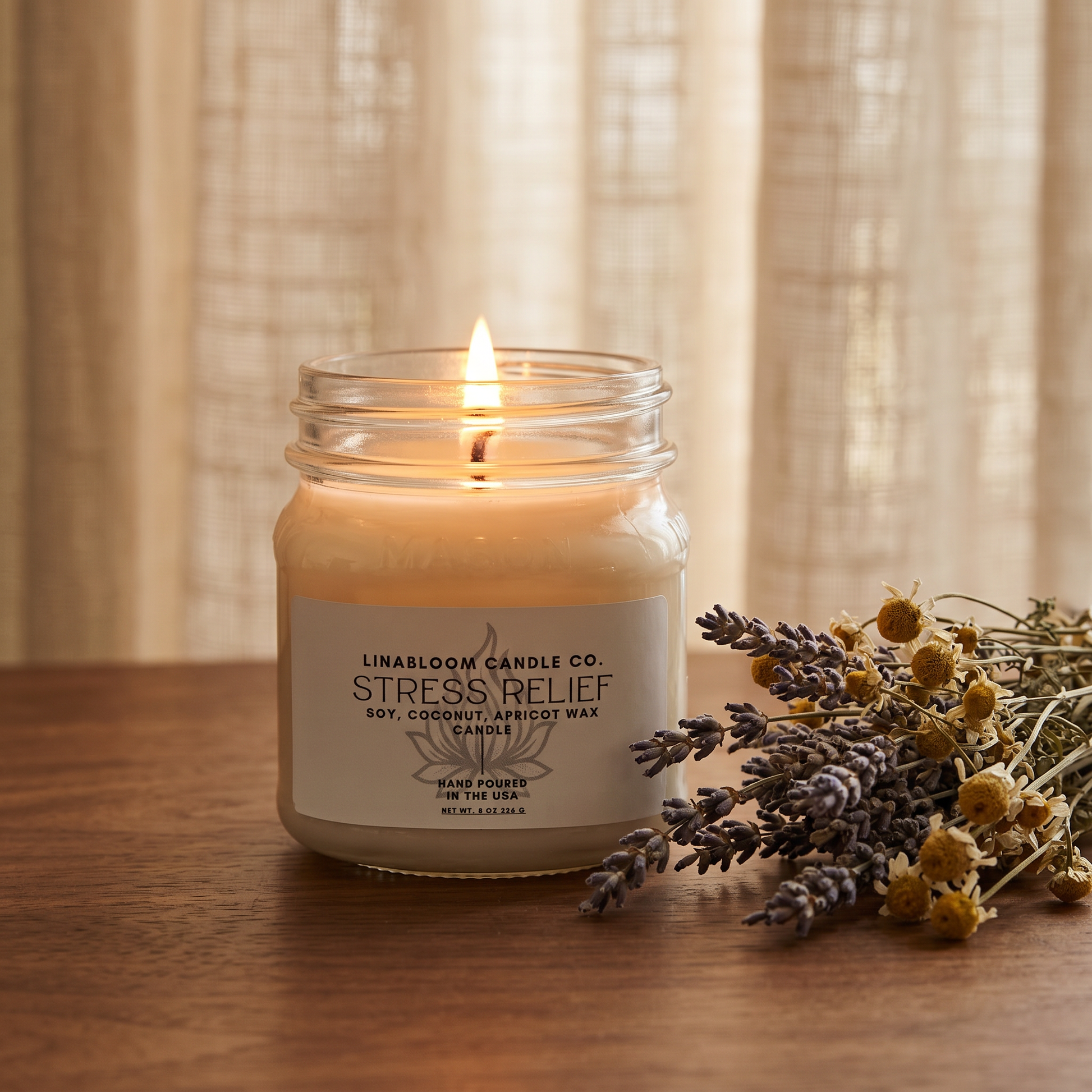 Stress Relief 8oz LinaBloom candle lit, with dried lavender and chamomile by a sunlit linen curtain