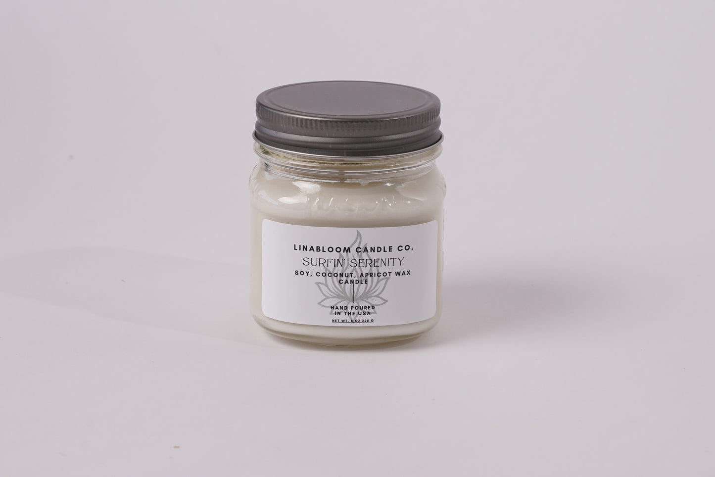 Surfin' Serenity 8oz hand-poured soy candle by LinaBloom — sea salt, sand, coconut milk, and frangipani