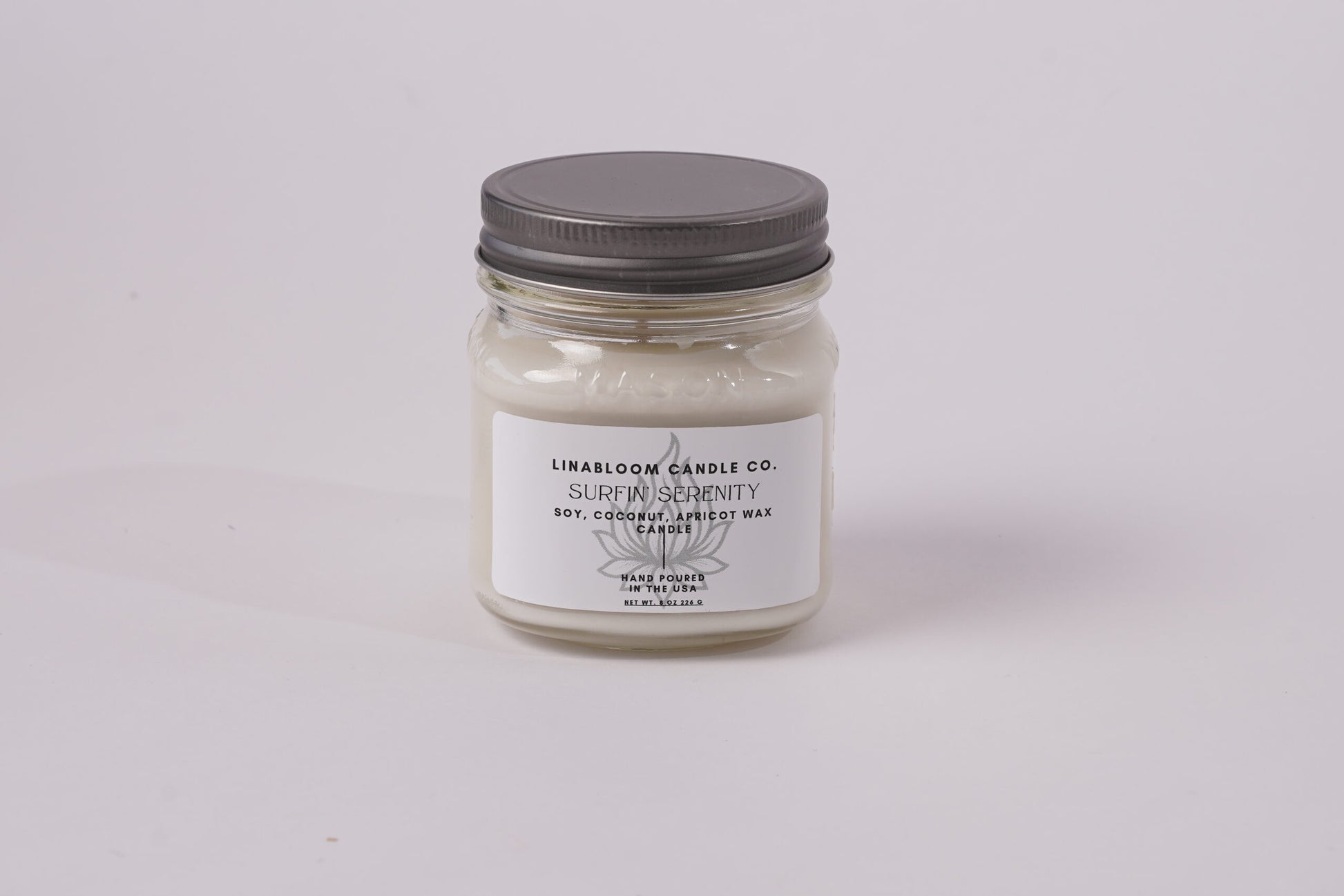 Surfin' Serenity 8oz hand-poured soy candle by LinaBloom — sea salt, sand, coconut milk, and frangipani