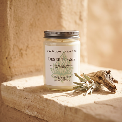 Desert Oasis 12oz LinaBloom candle on a sunlit sandstone ledge with dried sage and weathered cedar